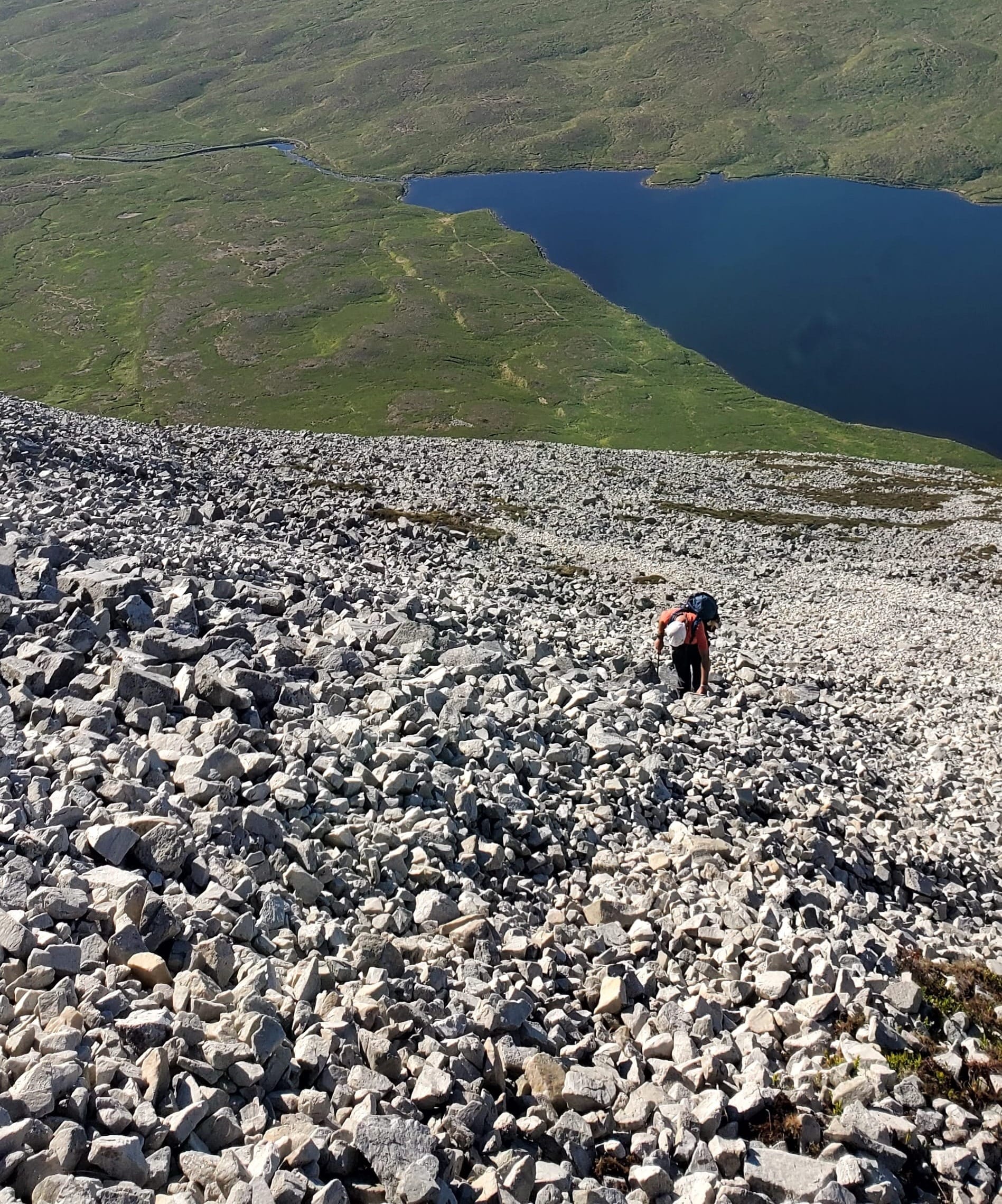 Ron climbing up scree. 