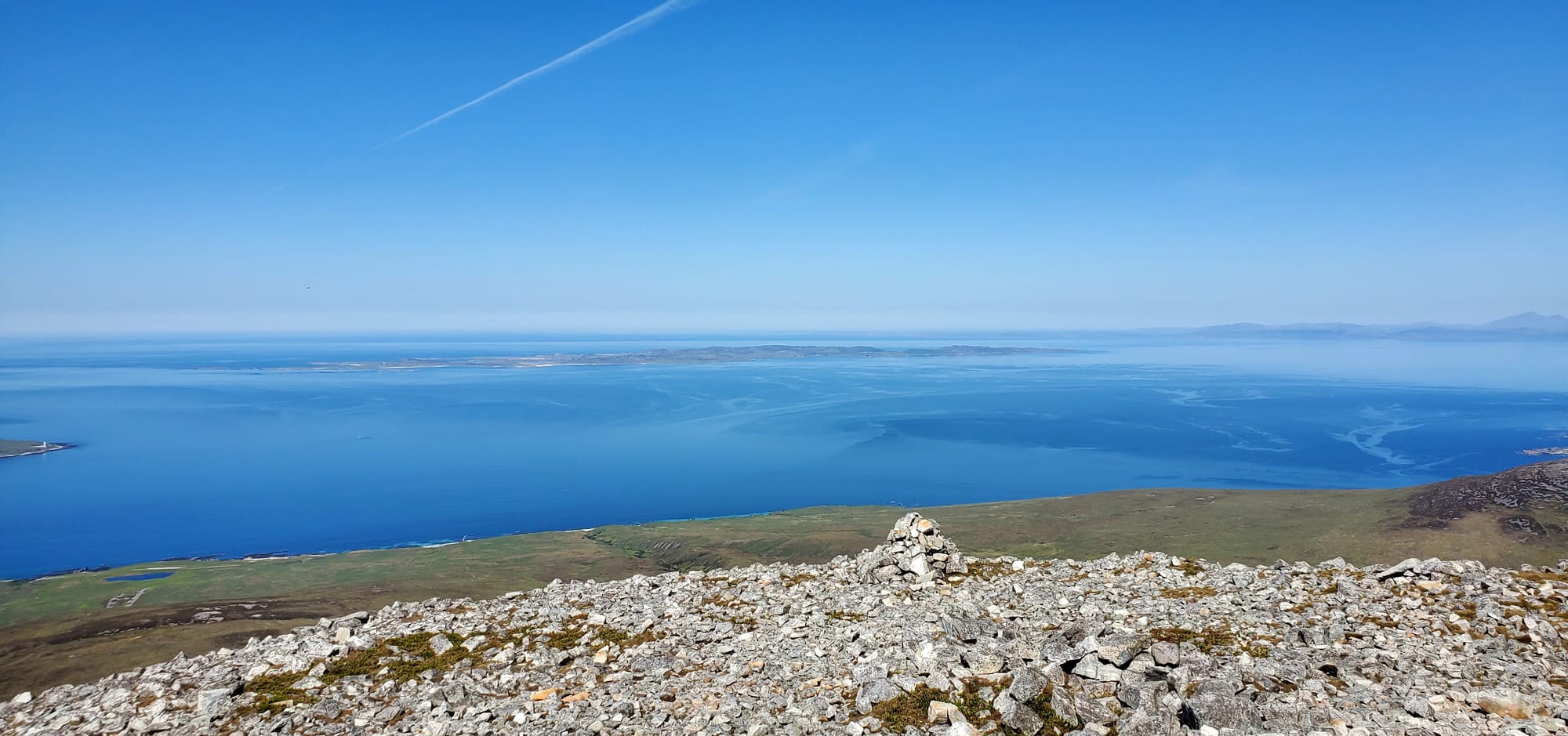 Panoramic views of the blue sea surrounding the island from the top of the Corbett.