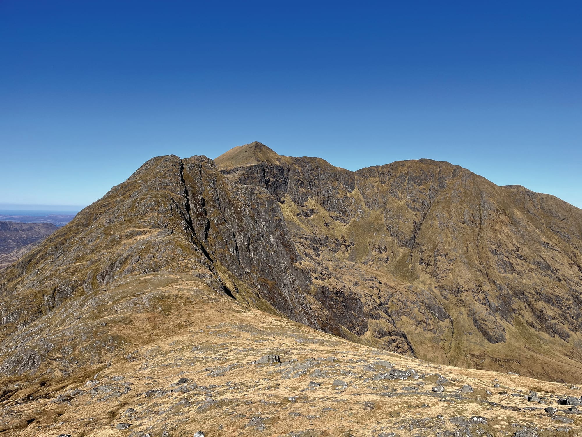 The ridge of Ladhar Bheinn against a blue sky.