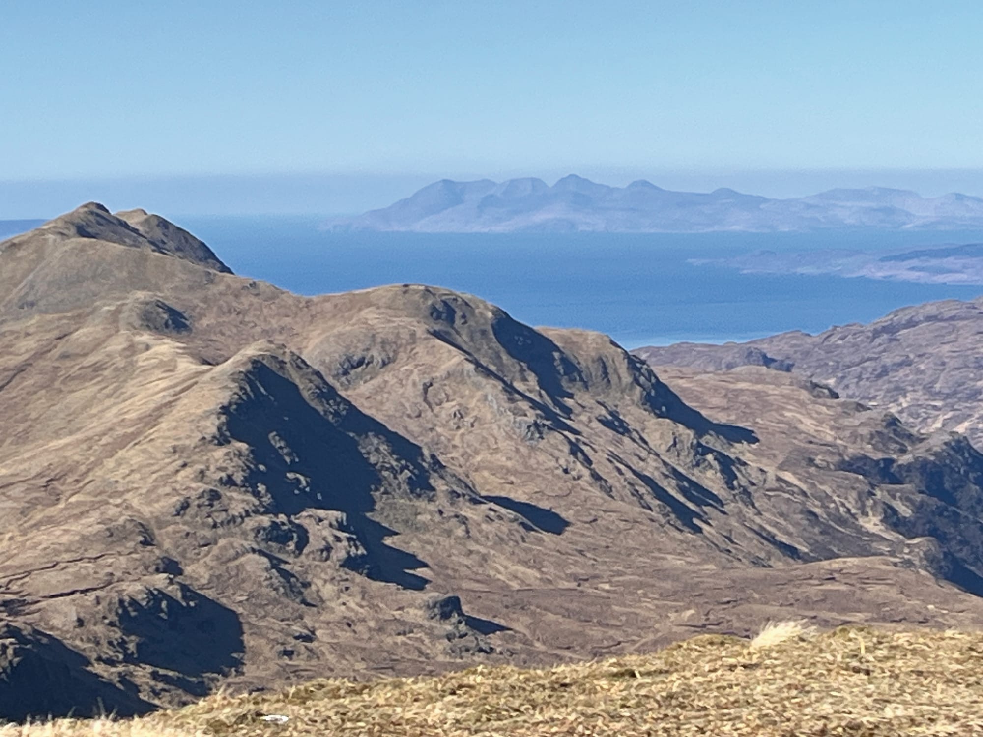 Views over the mountains out to the Western Isles.