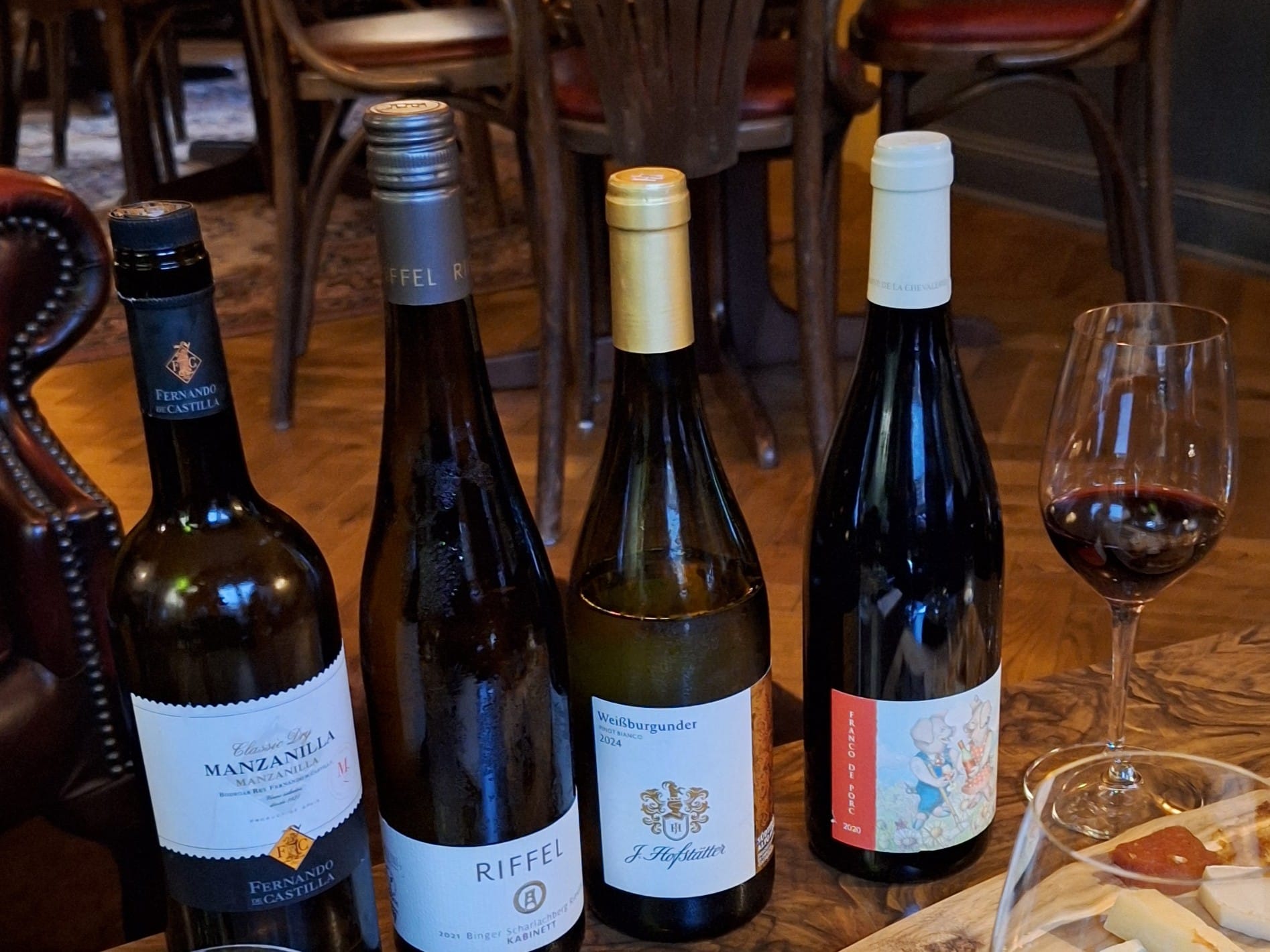 Four bottles of wine in a row.