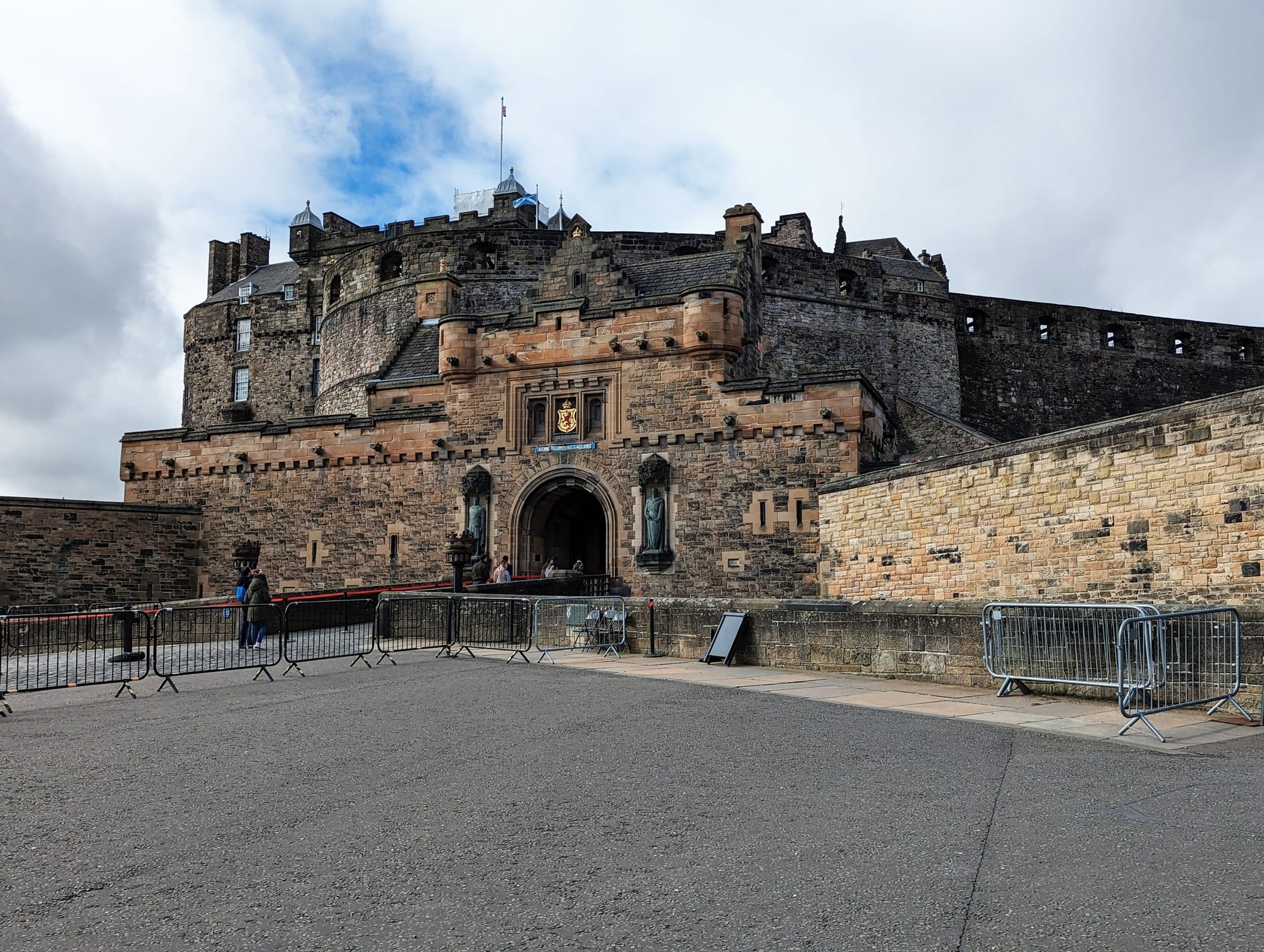 The entrance to Edinburgh Castle from the Royal Mile and the castle in the background.