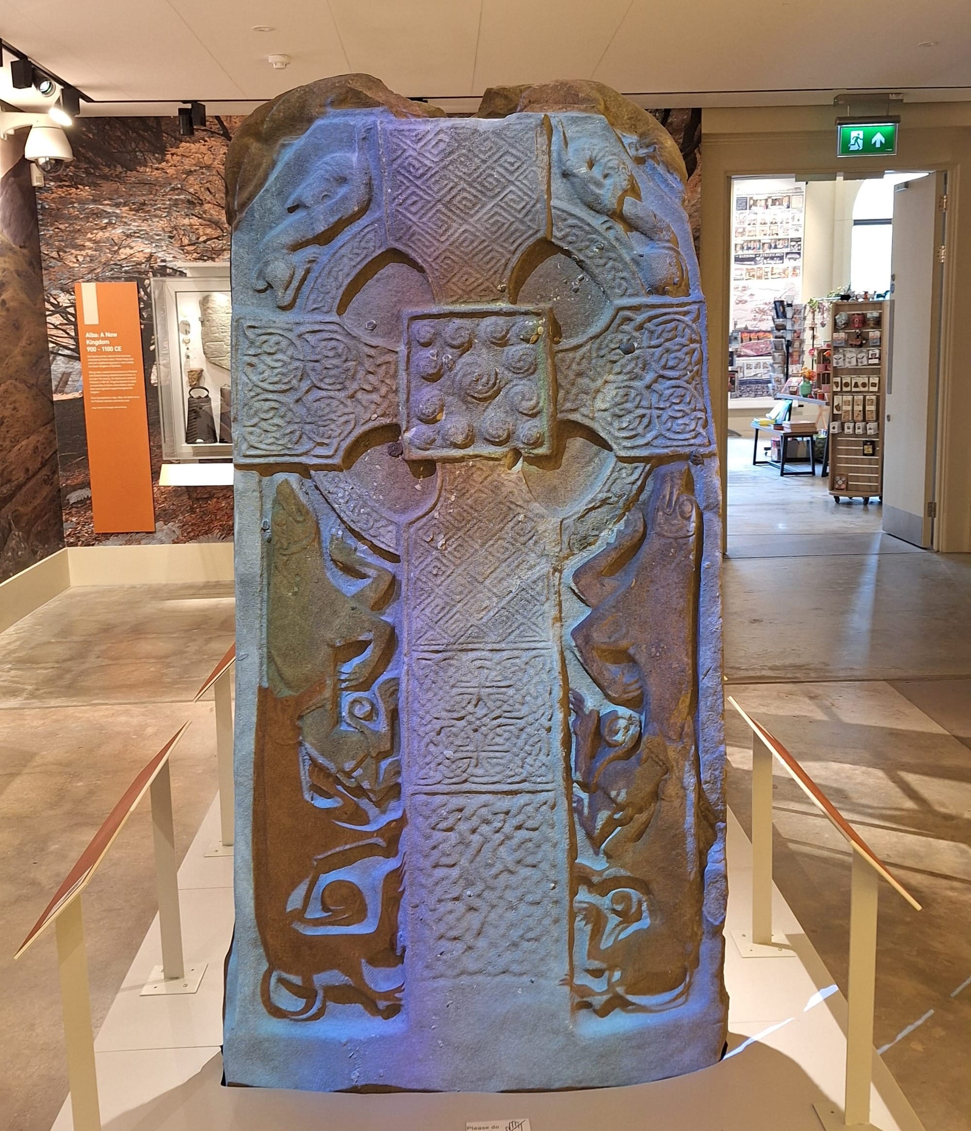 A Pictish stone with lights suggesting how it might once have been painted.