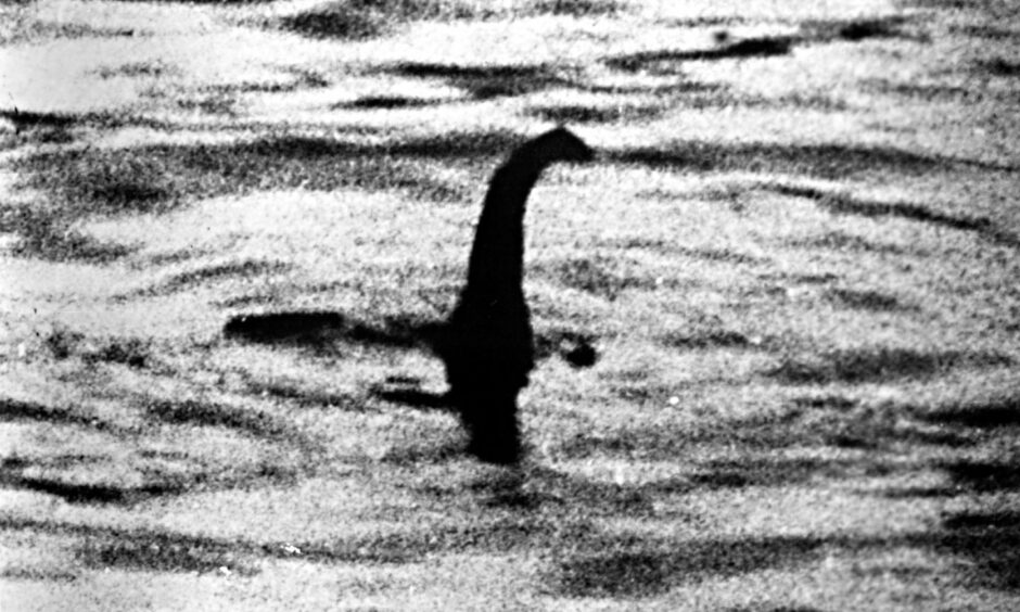 A grainy black-and-white image of the Loch Ness Monster.
