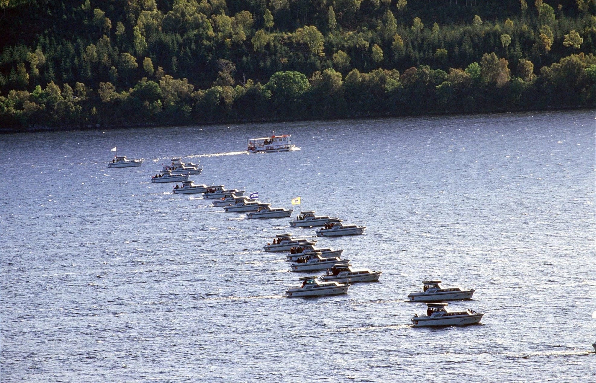 A row of boats crossing Loch Ness for Operation Deepscan.